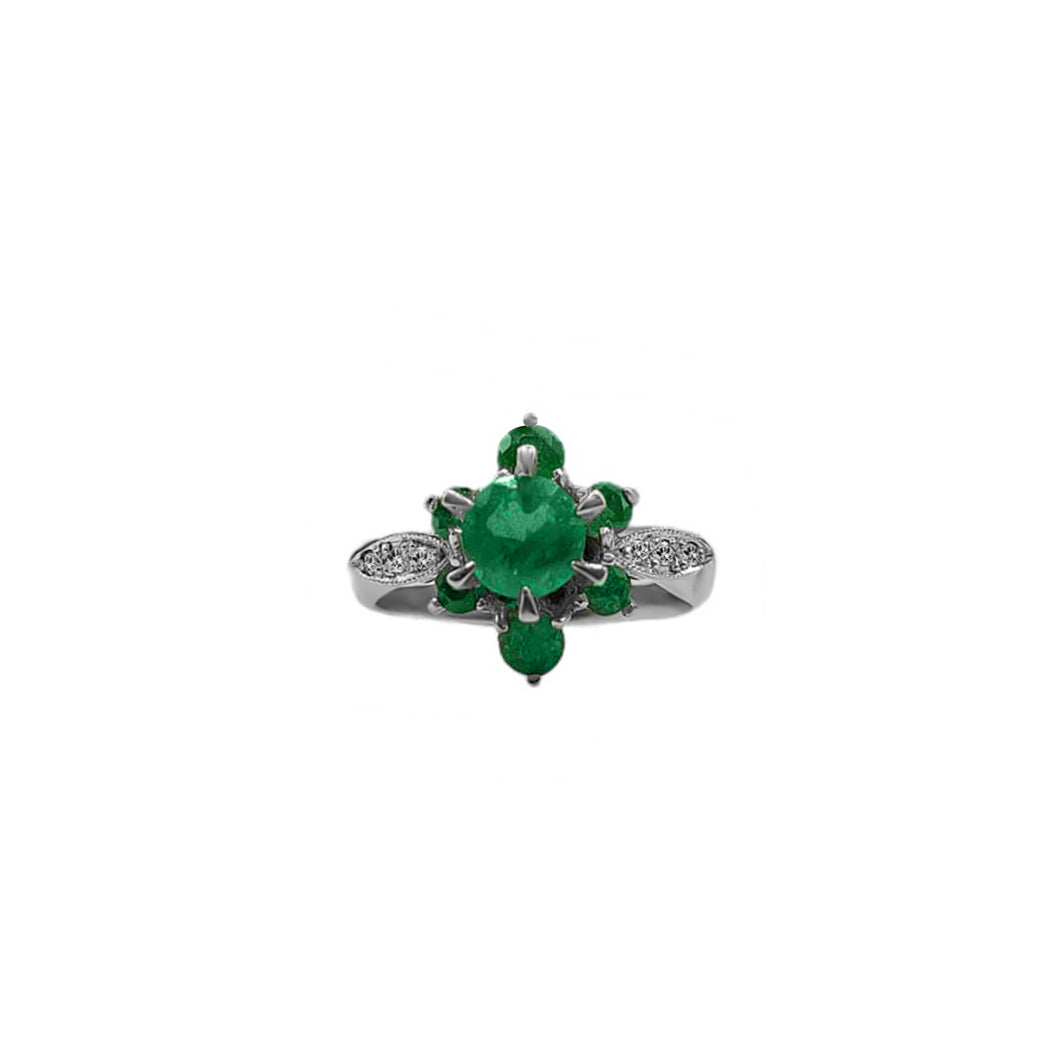 Anillo Flor en Esmeralda en Oro Blanco 18k